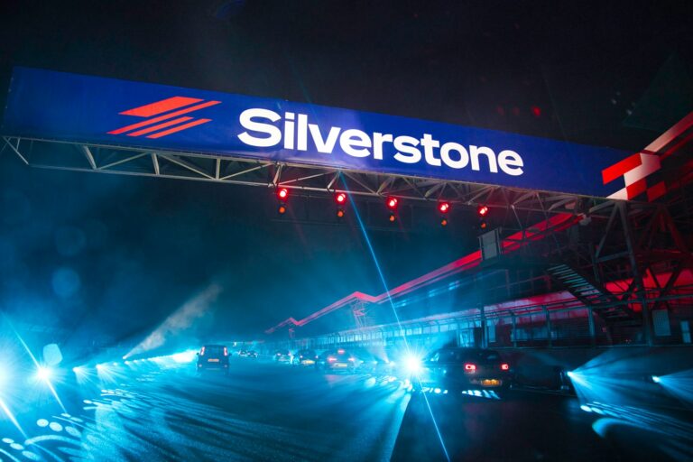 silverstone a silver stone sign above a highway at night