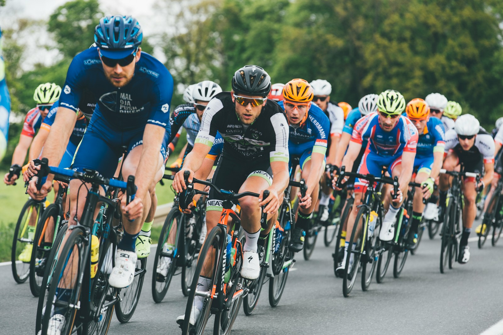 tour de france group of cyclist on asphalt road